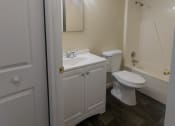 Thumbnail 21 of 33 - a bathroom with a toilet sink and mirror