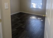Thumbnail 23 of 28 - an empty bedroom with a ceiling fan and a window