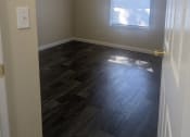 Thumbnail 19 of 33 - an empty bedroom with a ceiling fan and a window