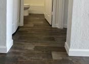 Thumbnail 20 of 21 - a bathroom with a toilet and a hallway with white doors