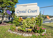Thumbnail 1 of 54 - A sign that says Crystal Court in front of a fence.