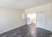 Thumbnail 48 of 54 - A room with a white door and a grey floor.