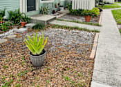 Thumbnail 14 of 32 - a small blue house with a sidewalk in front of it