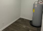 Thumbnail 22 of 33 - the interior of a room with a water heater