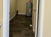 Thumbnail 29 of 33 - an empty room with a heater in it