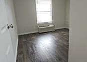 Thumbnail 6 of 33 - A room with a ceiling fan and a window with blinds.