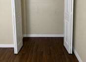 Thumbnail 15 of 22 - an empty room with a closet and a door