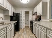 Thumbnail 17 of 23 - Kitchen with cabinets at Birch Run, Clarkston, 30021