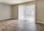 Thumbnail 14 of 16 - Vacant Living Room with Large Windows at The Benton Apartment Homes, Hoover, Alabama