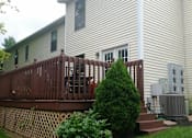 Thumbnail 3 of 21 - a white house with a fence in front of it