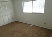 Thumbnail 8 of 13 - an empty room with a window and a closet