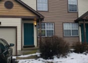 Thumbnail 1 of 18 - a house with a car parked in the snow