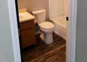 Thumbnail 16 of 18 - a small bathroom with a toilet and a sink