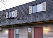 Thumbnail 11 of 11 - the front of a house with two red doors