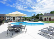 Thumbnail 20 of 21 - Pool With Relaxing Chairs at Stone Crossing, Springfield, OH, 45503