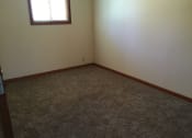 Thumbnail 14 of 17 - Bedroom with wooden floor and window at Dutch Hills Terrace Apartments, Parkersburg, West Virginia