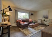 Thumbnail 1 of 19 - A living room with couch