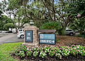 Thumbnail 33 of 42 - A sign for 29 Eggwater Leasing Office is in front of a flower bed.
