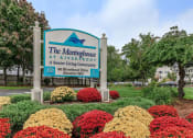Thumbnail 1 of 57 - the neighborhood at riverfront sign in front of flowers