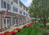 Thumbnail 2 of 57 - the residence has a beautiful lawn and landscaping in front of the building