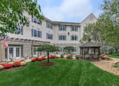 Thumbnail 3 of 57 - a gazebo in the front yard of an apartment building