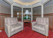 Thumbnail 17 of 57 - a living room with two chairs and a table