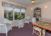 Thumbnail 19 of 57 - a dining room with a table and chairs
