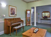 Thumbnail 26 of 57 - a view of a church with pews and a hall with paintings on the wall