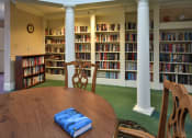 Thumbnail 35 of 57 - a table in a library with books on it