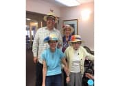 Thumbnail 49 of 57 - a group of people wearing hats and posing for a picture