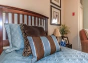 Thumbnail 56 of 57 - a bedroom with a bed with pillows