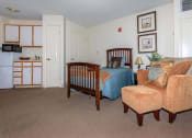 Thumbnail 57 of 57 - a bedroom with a bed and a living room with a couch
