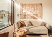 Thumbnail 2 of 36 - a living room with a couch and a window at Scout Living, powered by Placemakr Apartments, Atlanta, GA