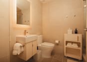 Thumbnail 24 of 36 - a bathroom with a toilet and a sink and a mirror at Scout Living, powered by Placemakr Apartments, Georgia 30308