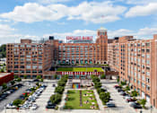 Thumbnail 35 of 36 - an aerial view of a large brick building with a large sign on top of it at Scout Living, powered by Placemakr Apartments, Georgia
