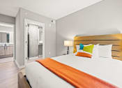 Thumbnail 12 of 14 - Large bedroom with en-suite bathroom.