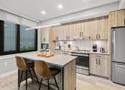 Thumbnail 11 of 14 - Modern, full kitchen with island.