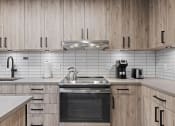 Thumbnail 13 of 14 - Modern, full kitchens.
