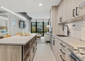 Thumbnail 9 of 14 - Apartment with modern, full kitchen.