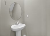 Thumbnail 9 of 36 - a small bathroom with a sink and a mirror