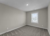 Thumbnail 15 of 36 - an empty room with white walls and a window