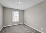 Thumbnail 17 of 36 - an empty room with carpet and a window