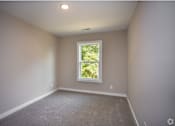Thumbnail 33 of 36 - an empty room with a window in it
