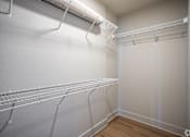 Thumbnail 26 of 39 - Empty white shelving unit in a room.