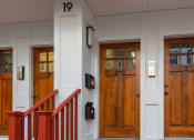 Thumbnail 1 of 14 - a row of wooden doors with numbers on them