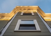 Thumbnail 5 of 14 - looking up the side of a building with vinyl siding and awning