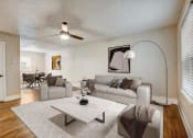 Thumbnail 7 of 23 - a living room with a couch and a table