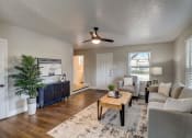 Thumbnail 11 of 23 - an open living room with a couch and a table