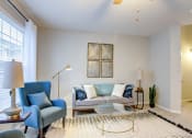 Thumbnail 1 of 42 - a living room with a couch chair and coffee table