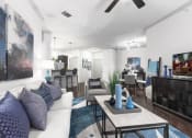 Thumbnail 3 of 14 - a living room filled with furniture and a ceiling fan